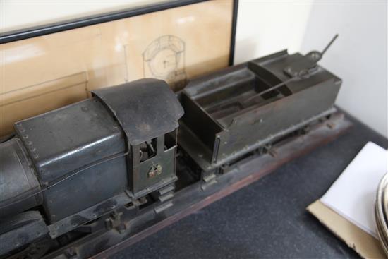 A scratchbuilt model of a 262 steam powered locomotive and tender,